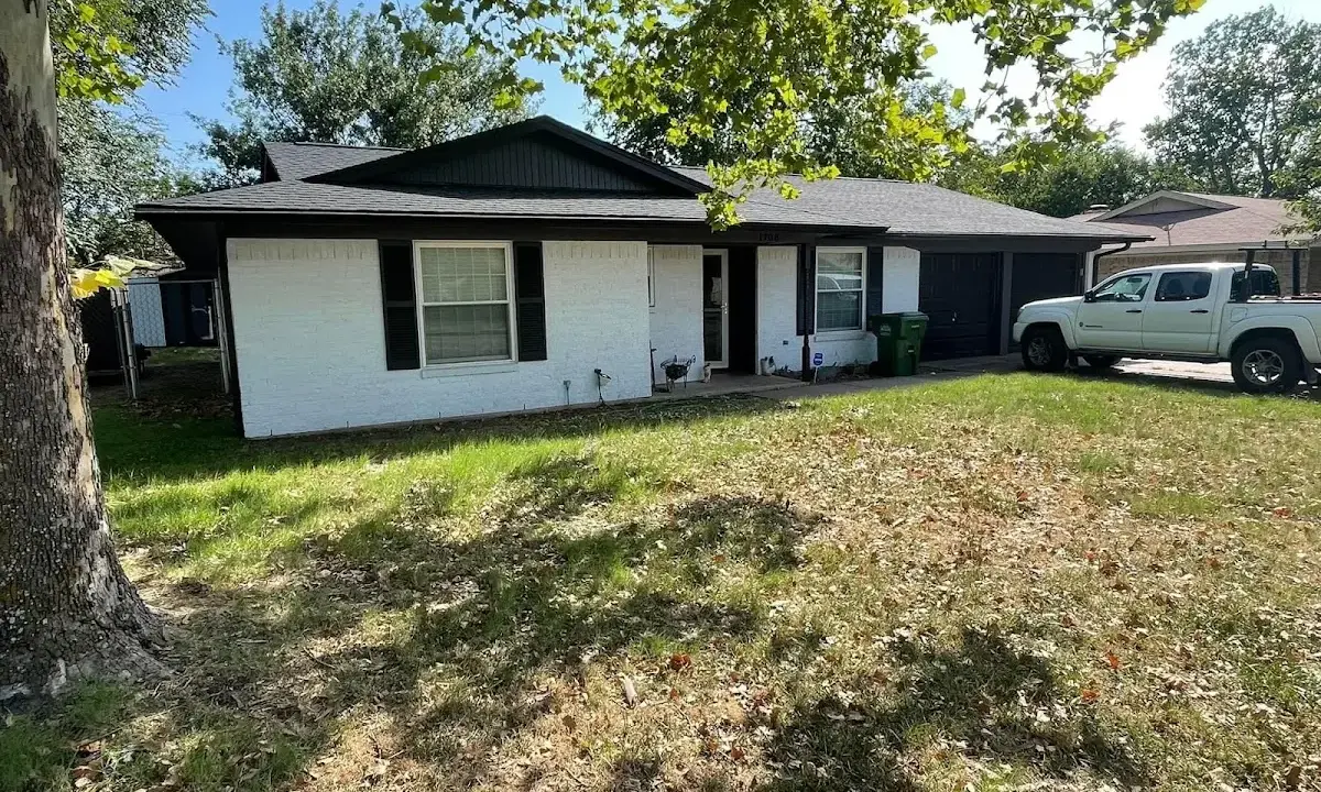 Professional roofing crew working on a residential roof in Myrtle Grove
