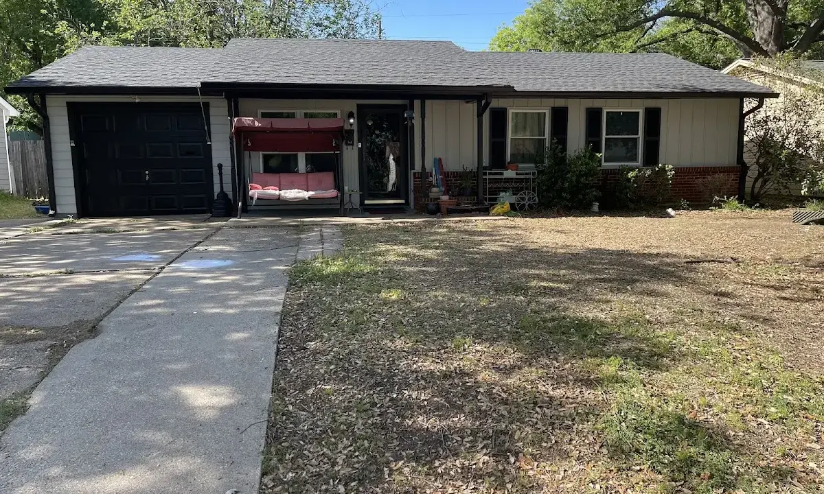 Metal Roof Installation crew at work on a residential roof in Myrtle Grove